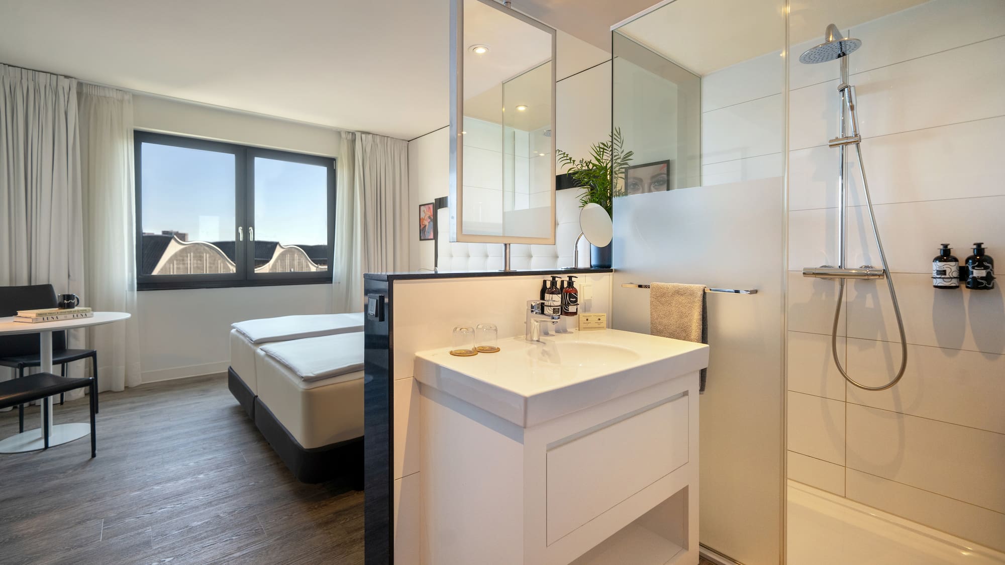 a bathroom with a shower and a bed