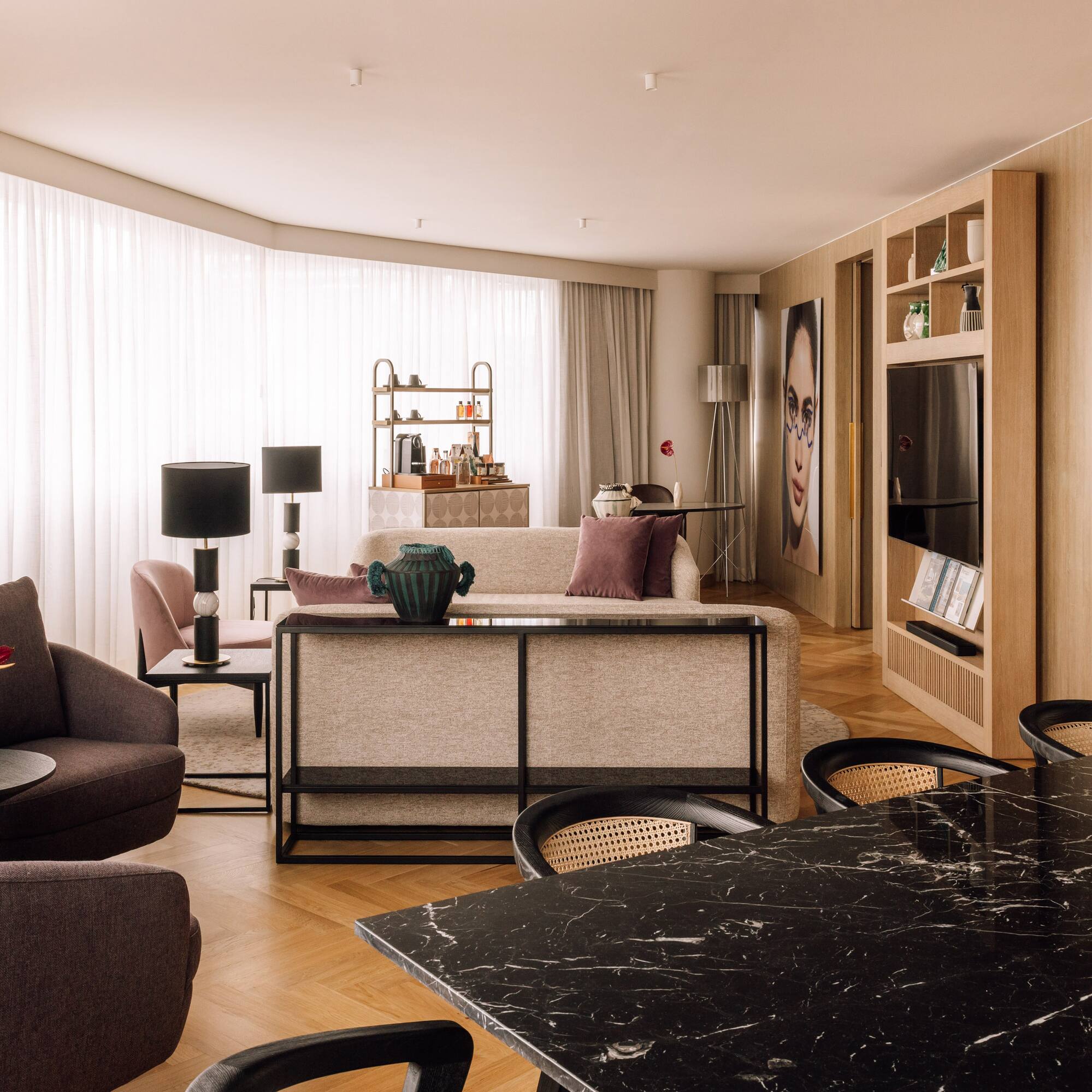 a living room with a table and chairs