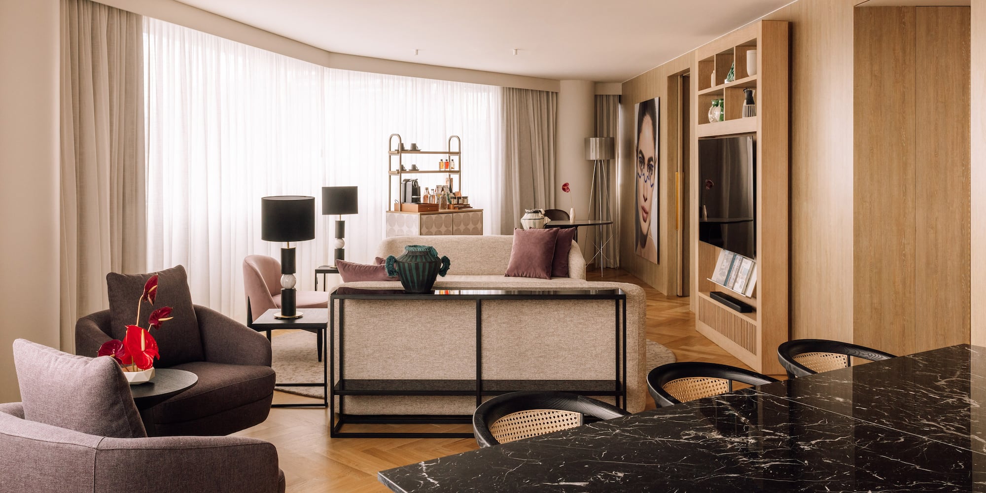 a living room with a table and chairs