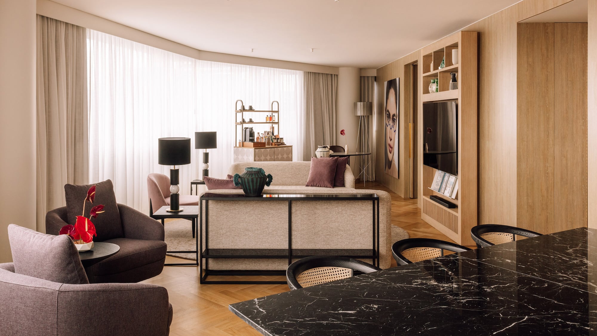 a living room with a table and chairs