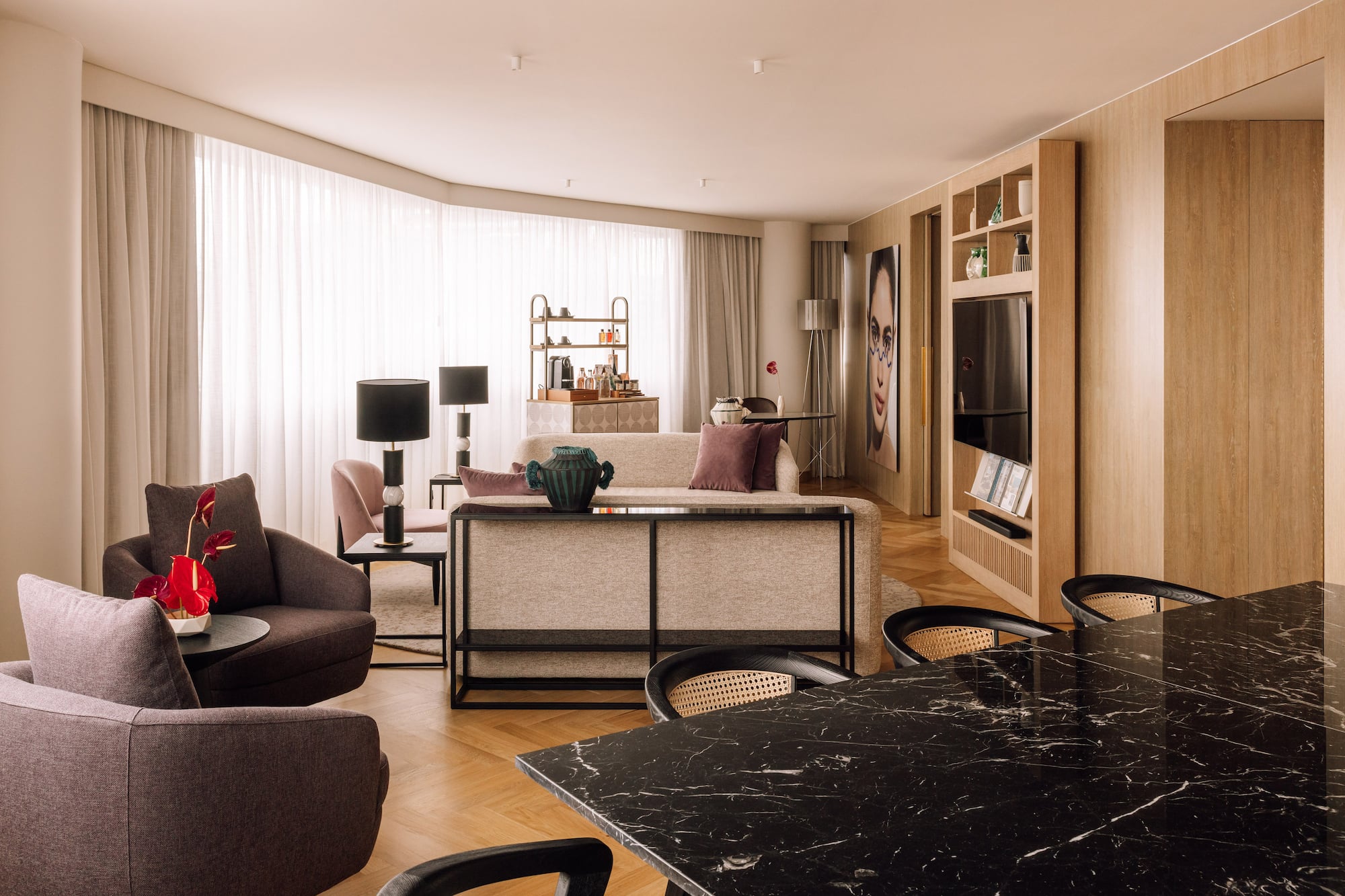 a living room with a table and chairs