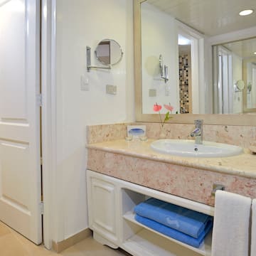 a bathroom with a sink and mirror