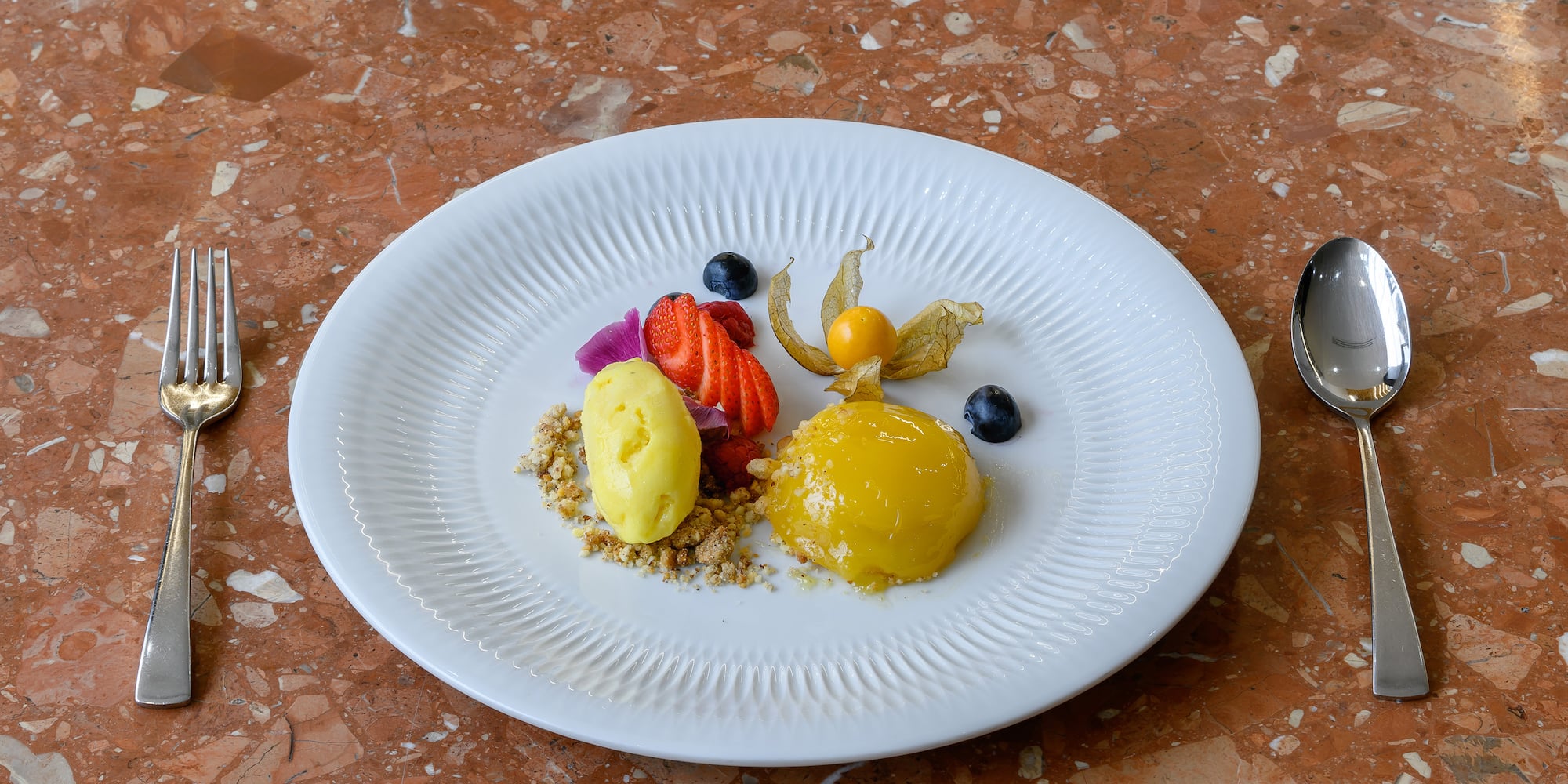 a plate of food on a marble surface