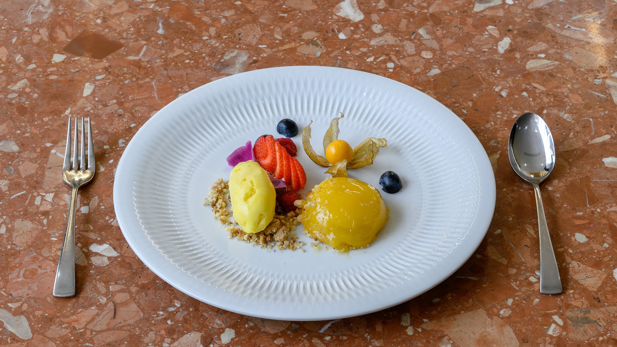 a plate of food on a marble surface
