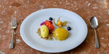 a plate of food on a marble surface