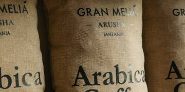 sacks with black text on them