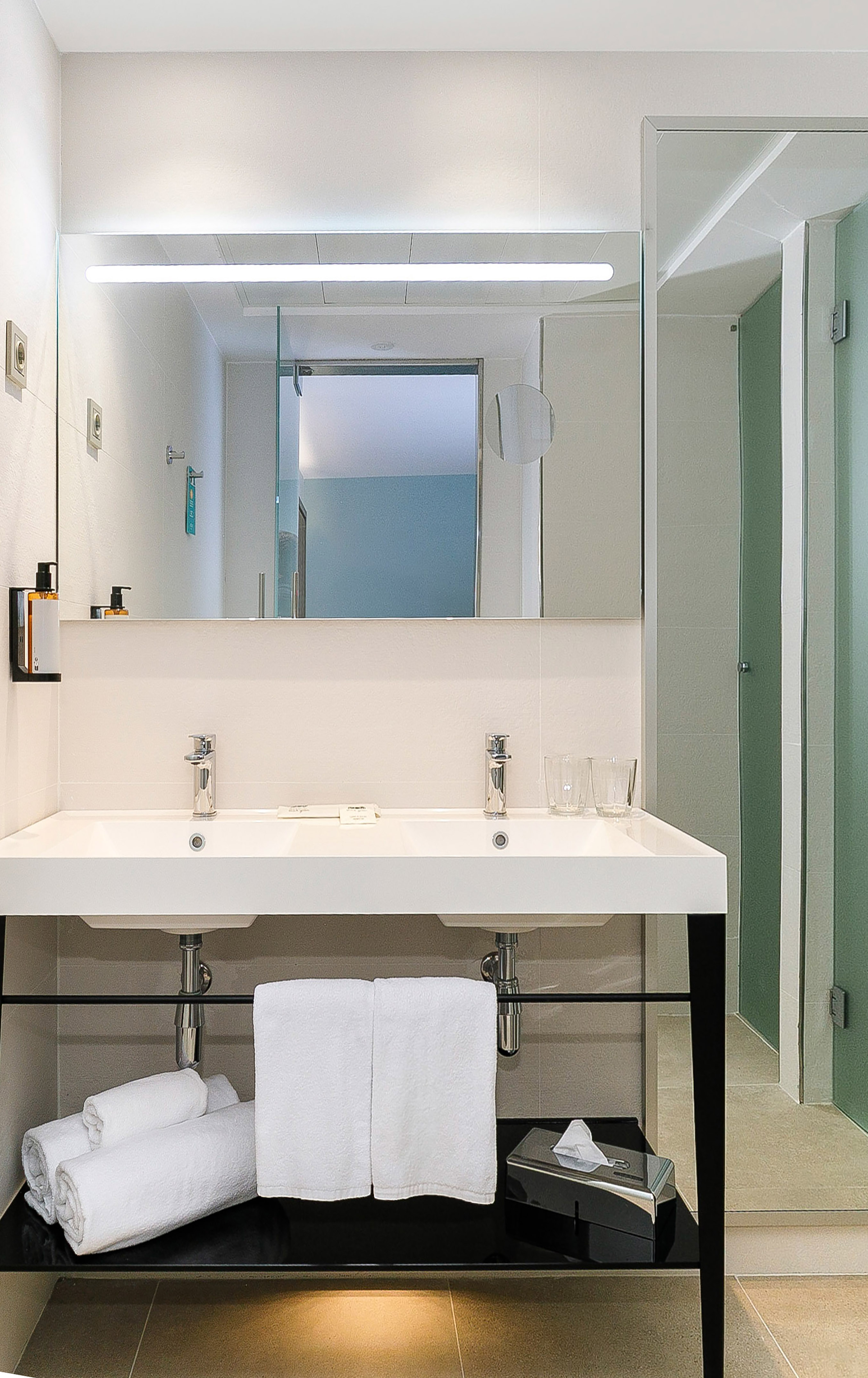 a bathroom with a mirror and sink