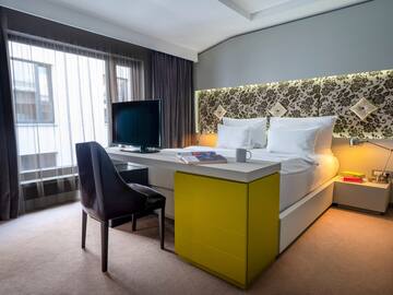 a room with a bed and a chair