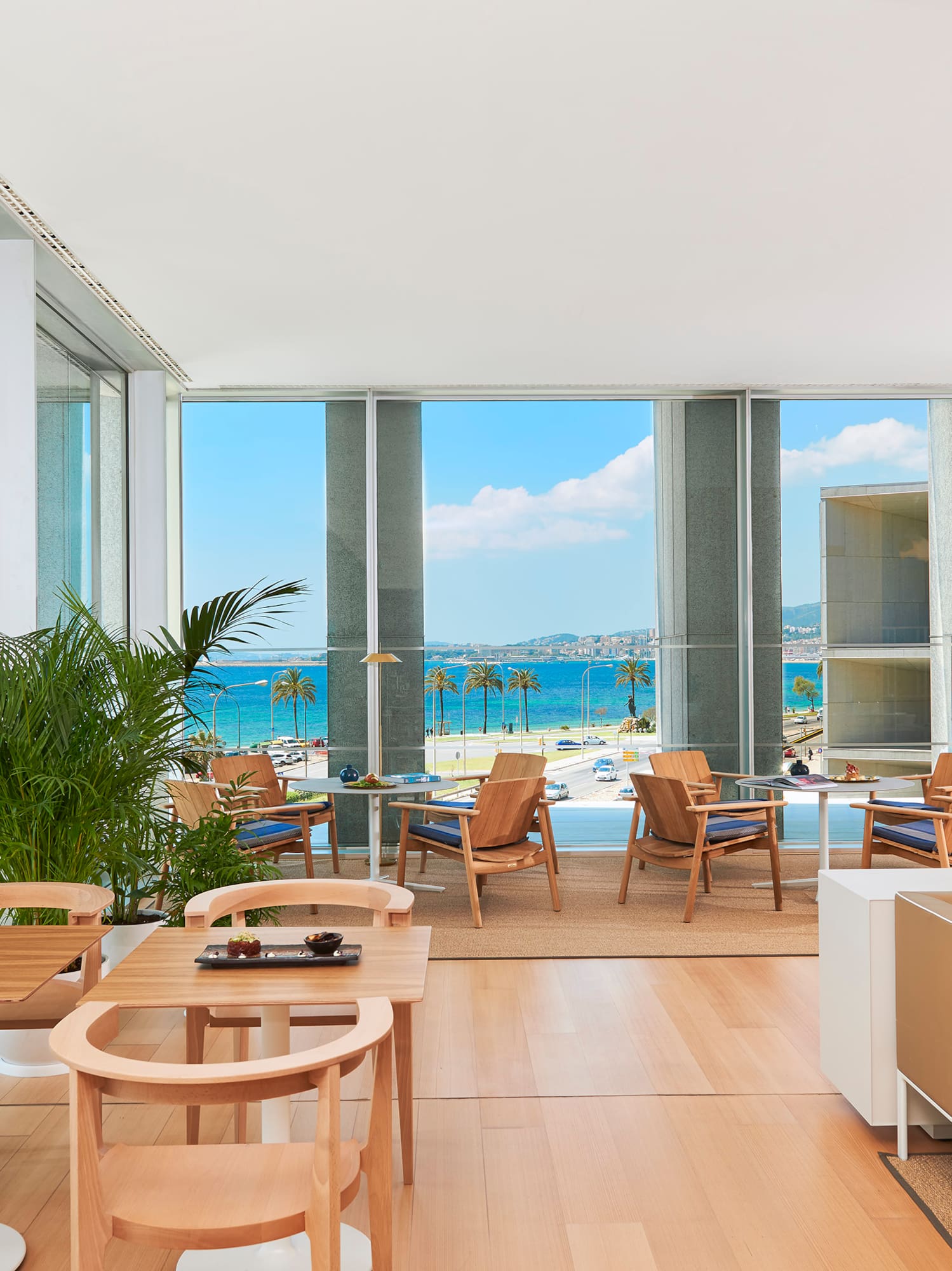 a room with a view of the beach and ocean