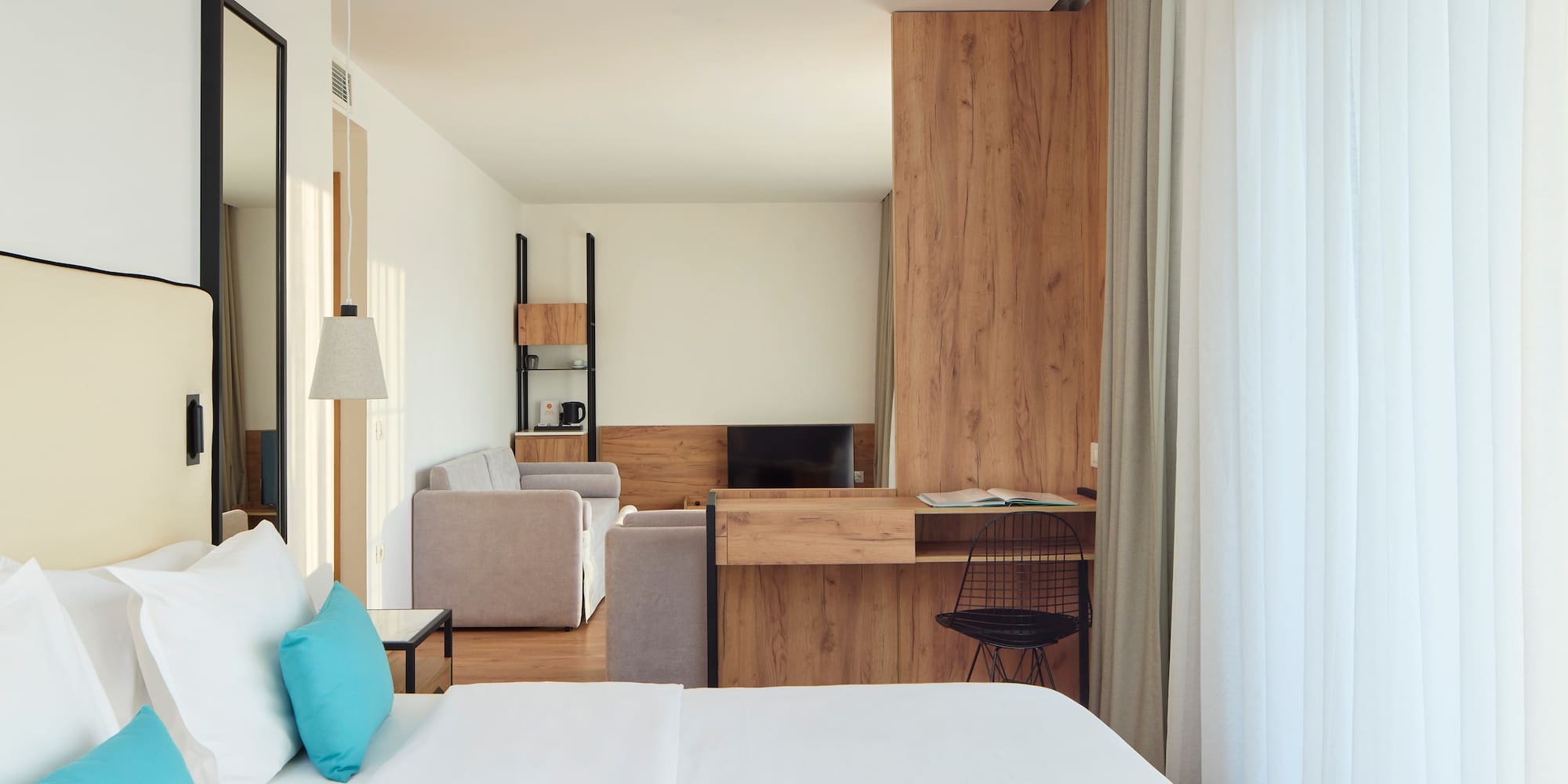 a room with a bed and a desk