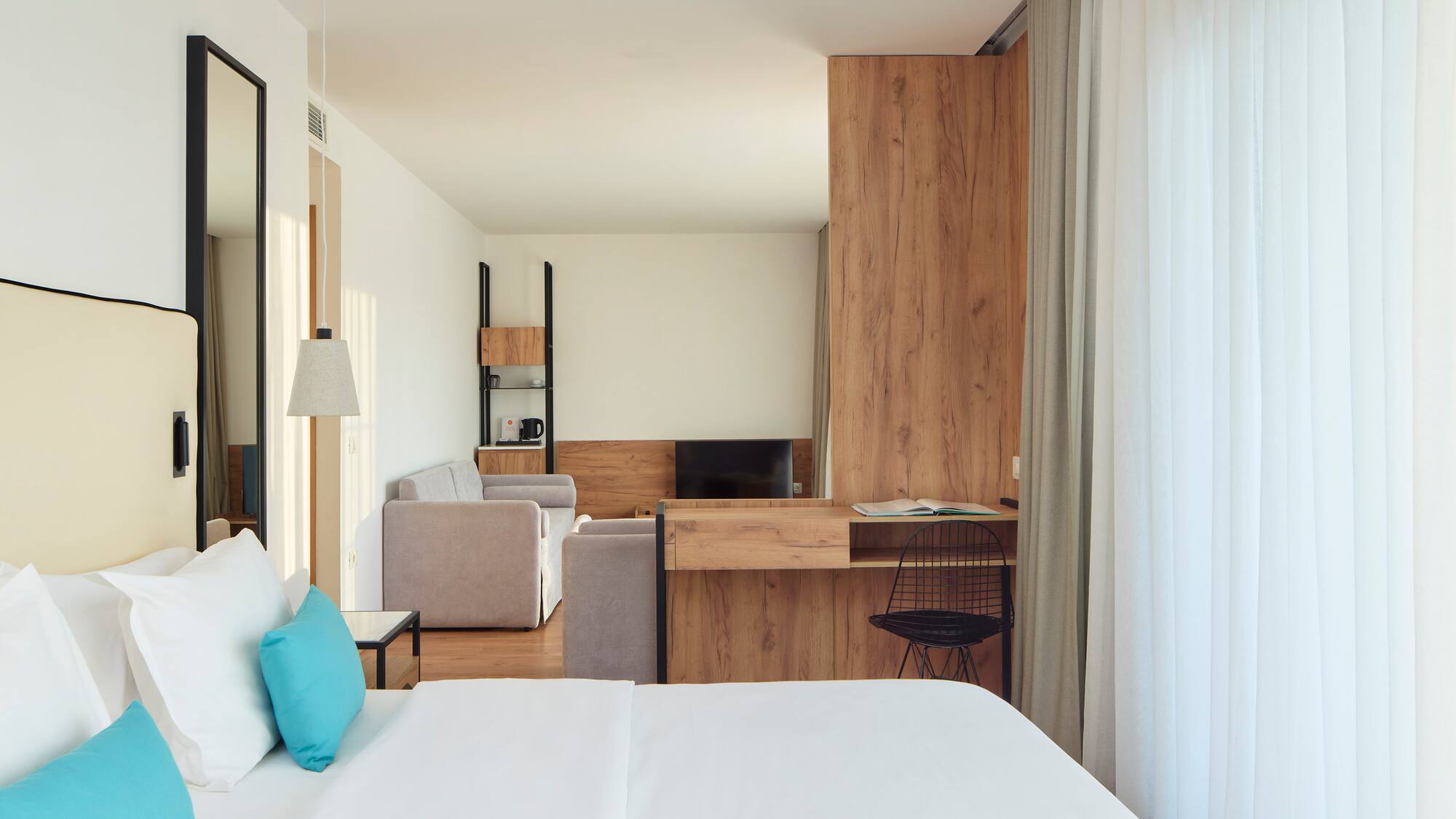 a room with a bed and a desk