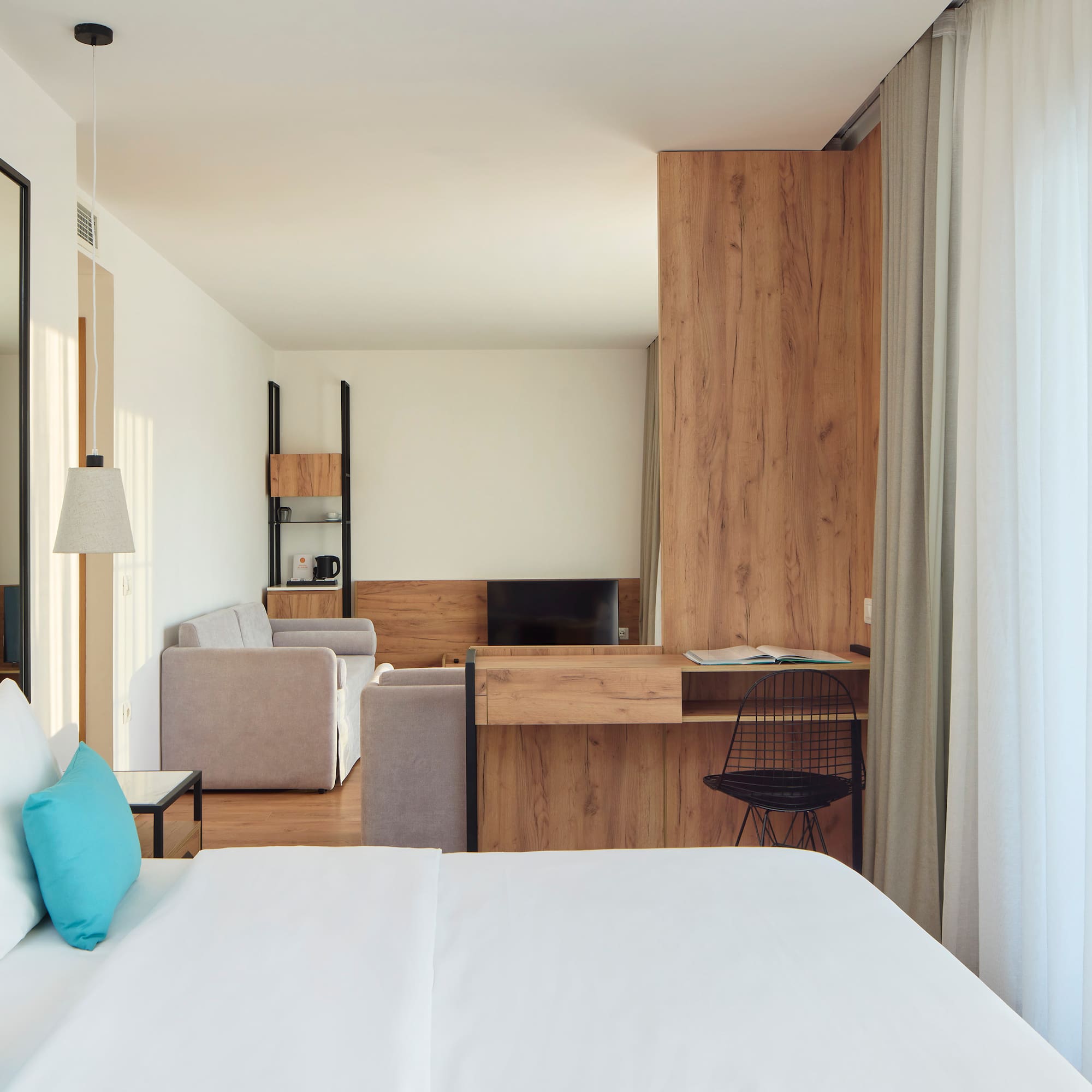 a room with a bed and a desk