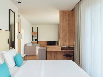 a room with a bed and a desk