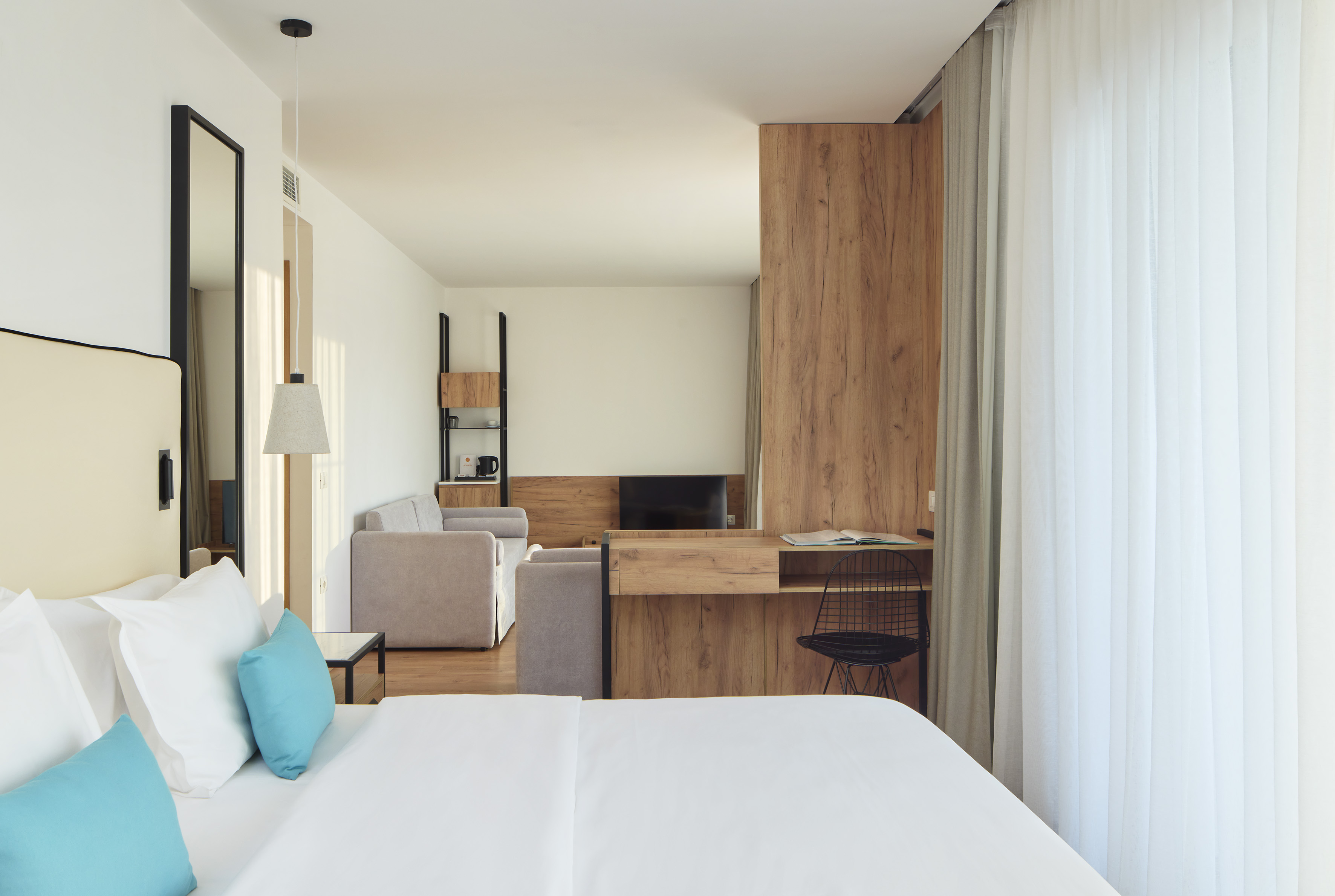 a room with a bed and a desk