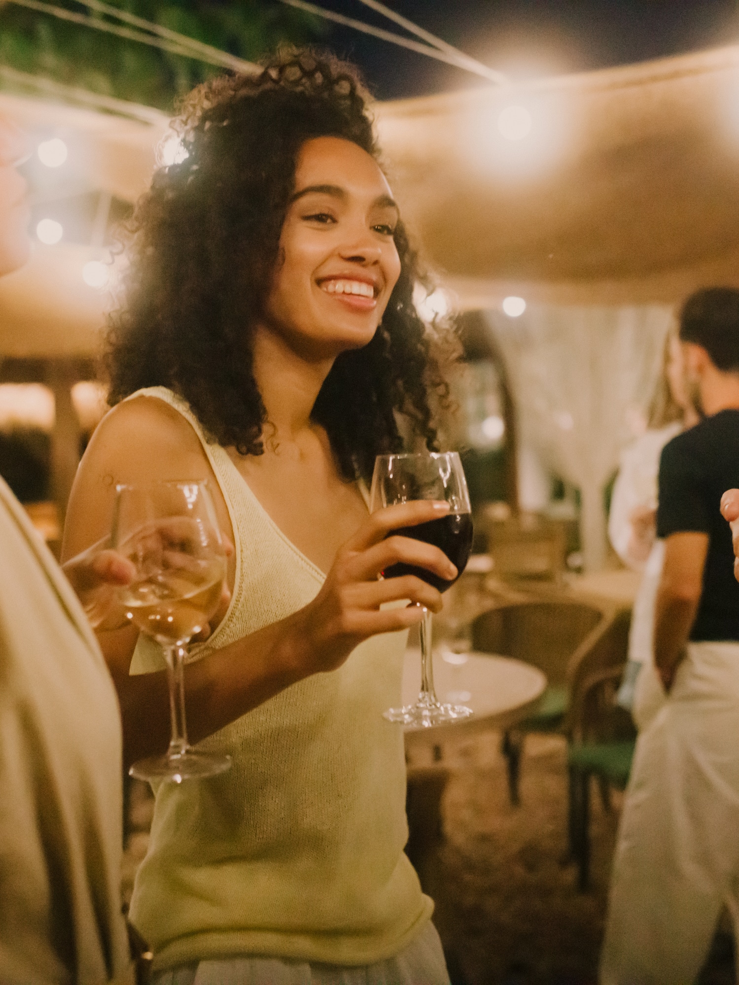 a group of people holding wine glasses