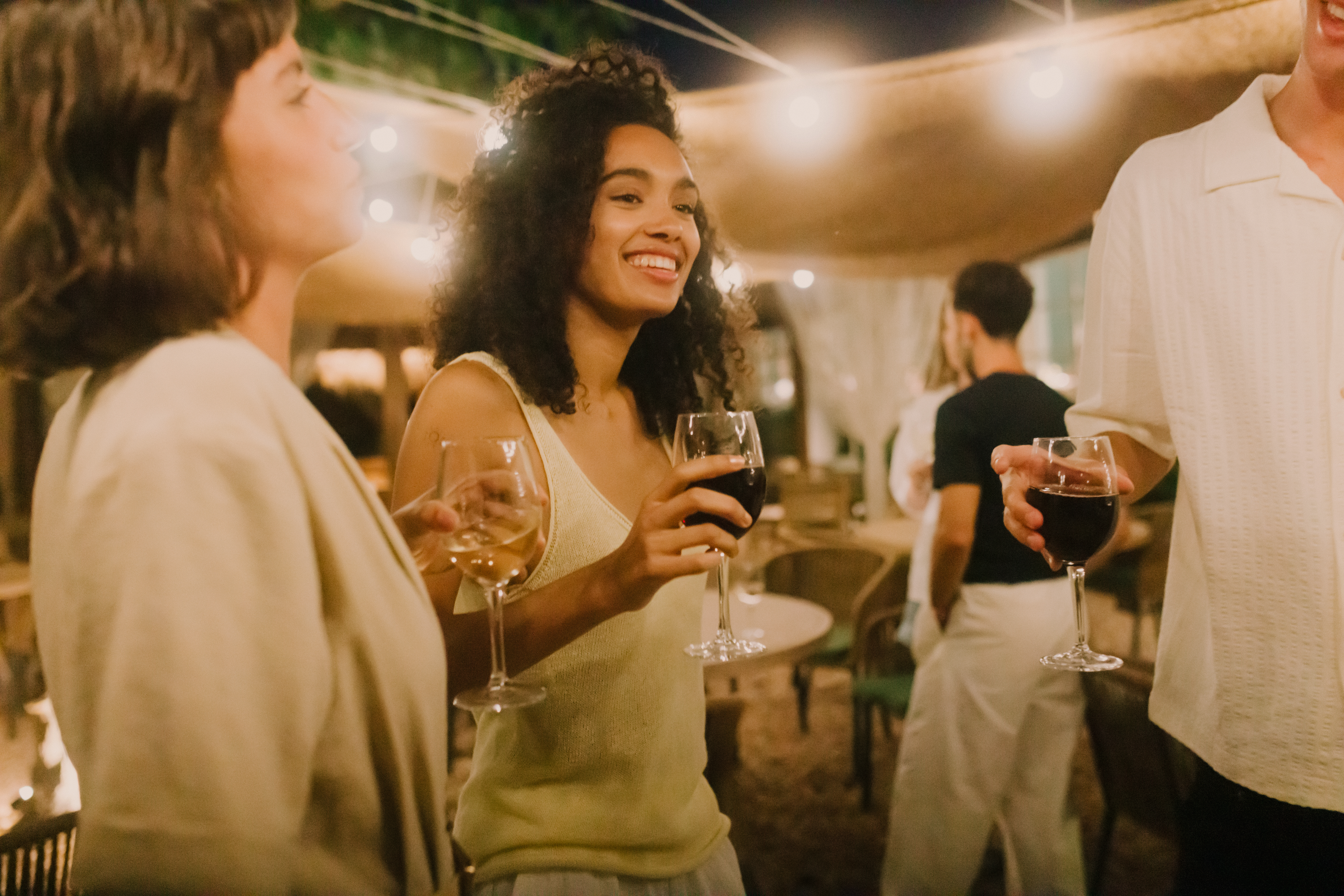 a group of people holding wine glasses