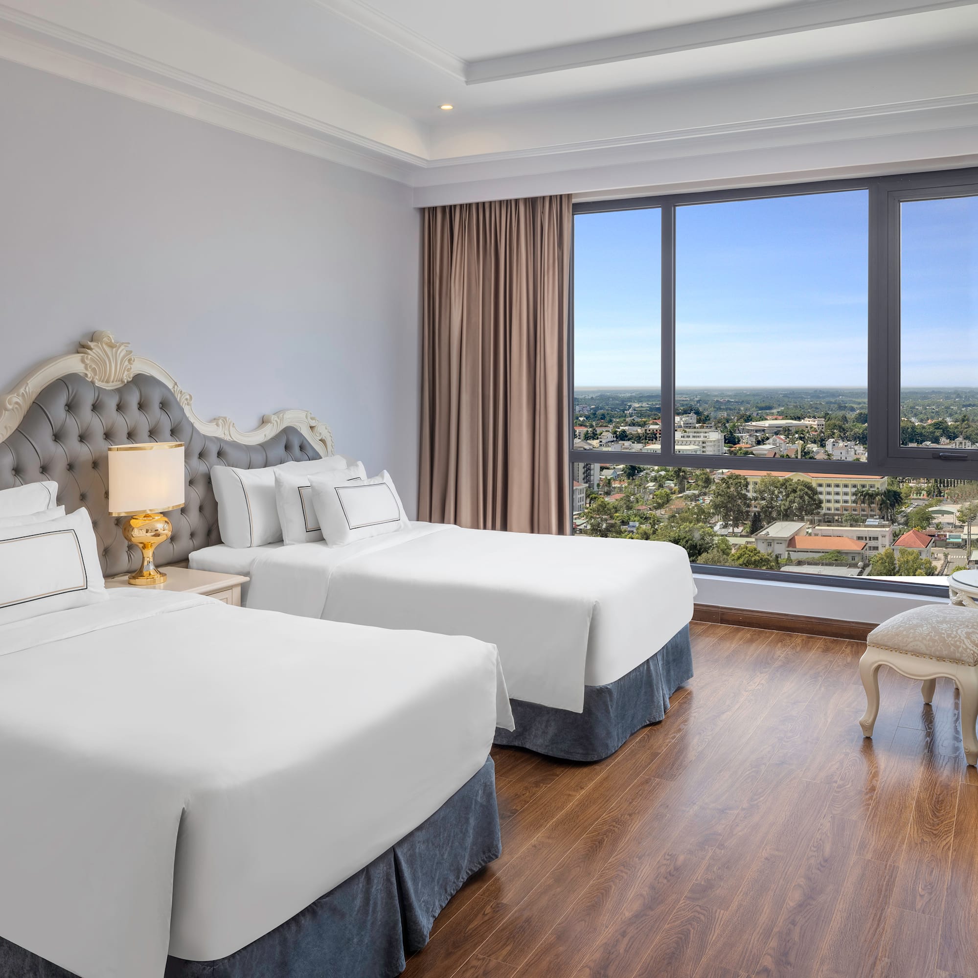 a room with two beds and a window