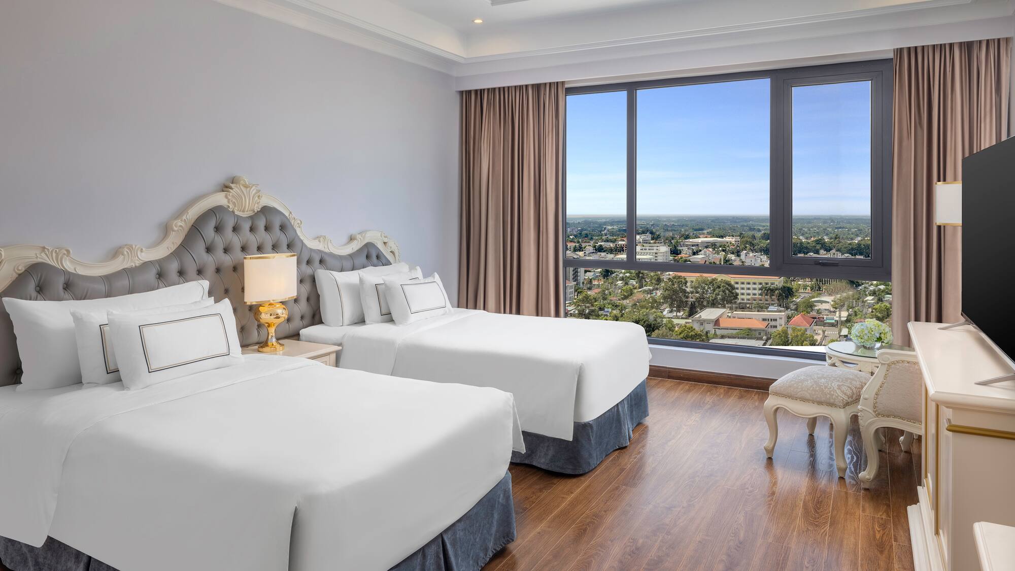 a room with two beds and a window