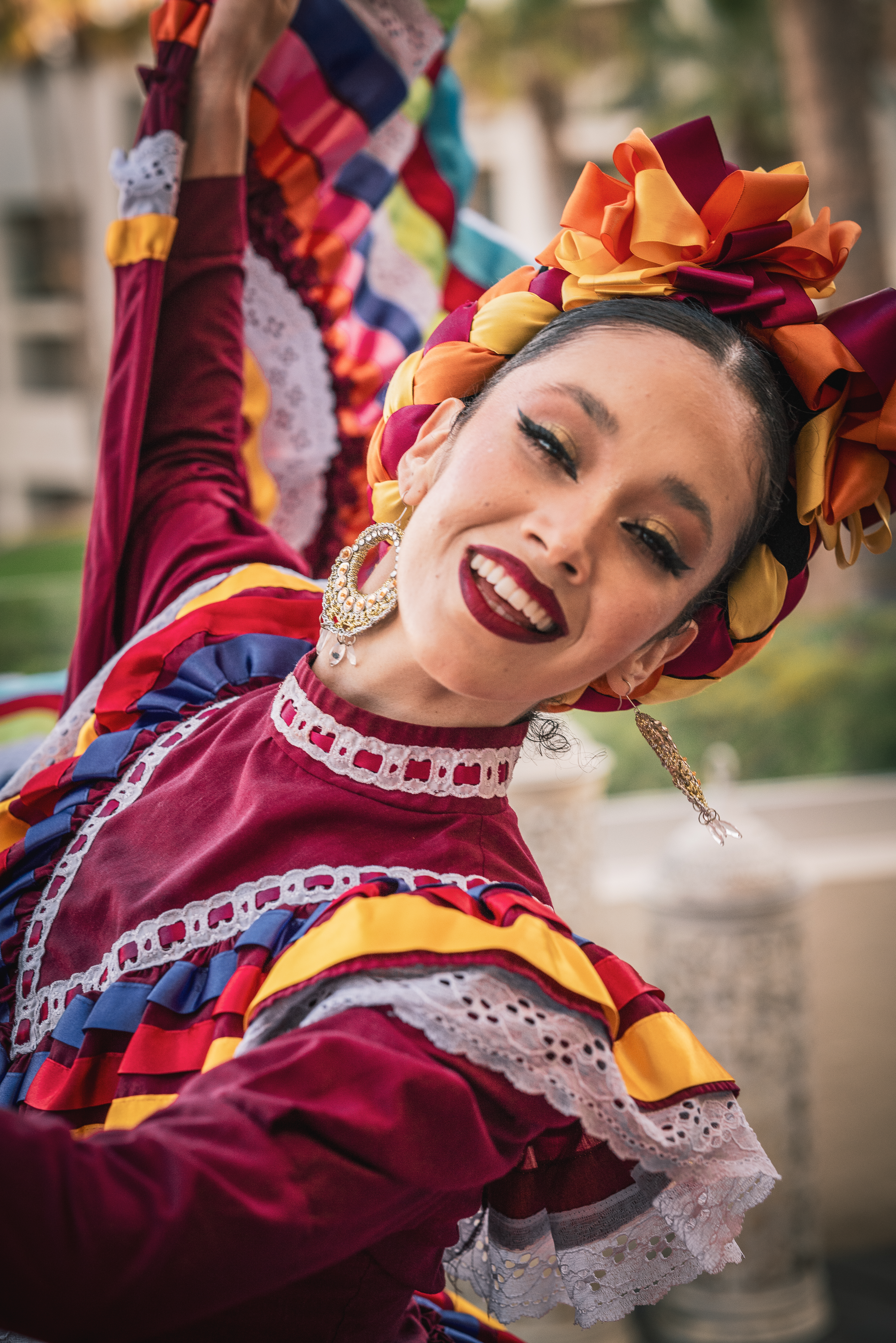 a woman wearing a colorful dress and smiling
