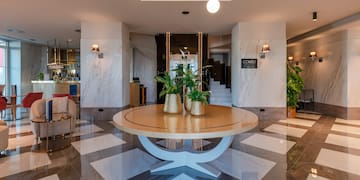 a bedroom with a mirror and a bed