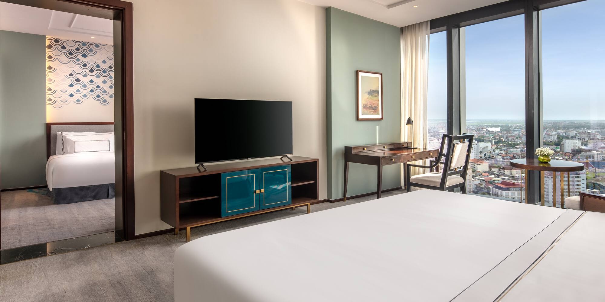 a room with a television and a city view