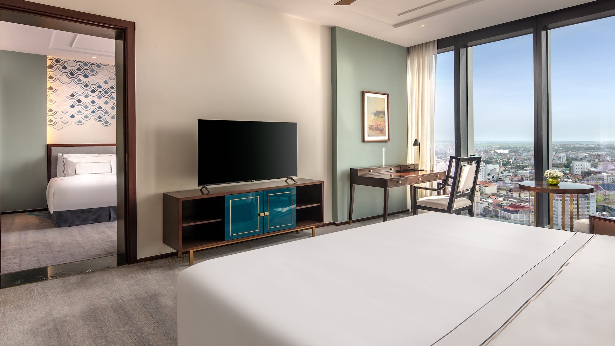 a room with a television and a city view