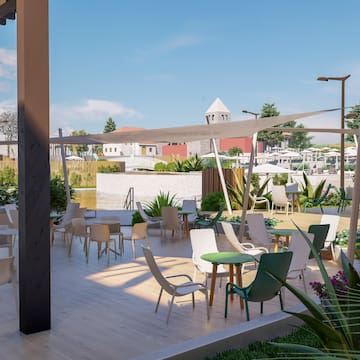 a patio with chairs and tables