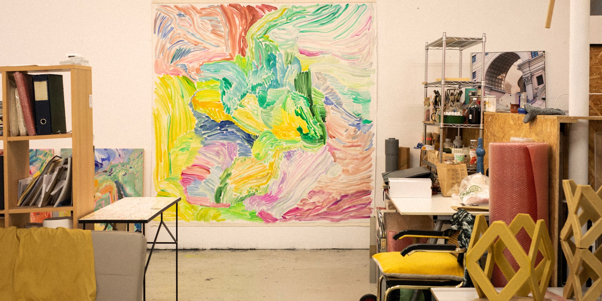 a room with a large painting on the wall