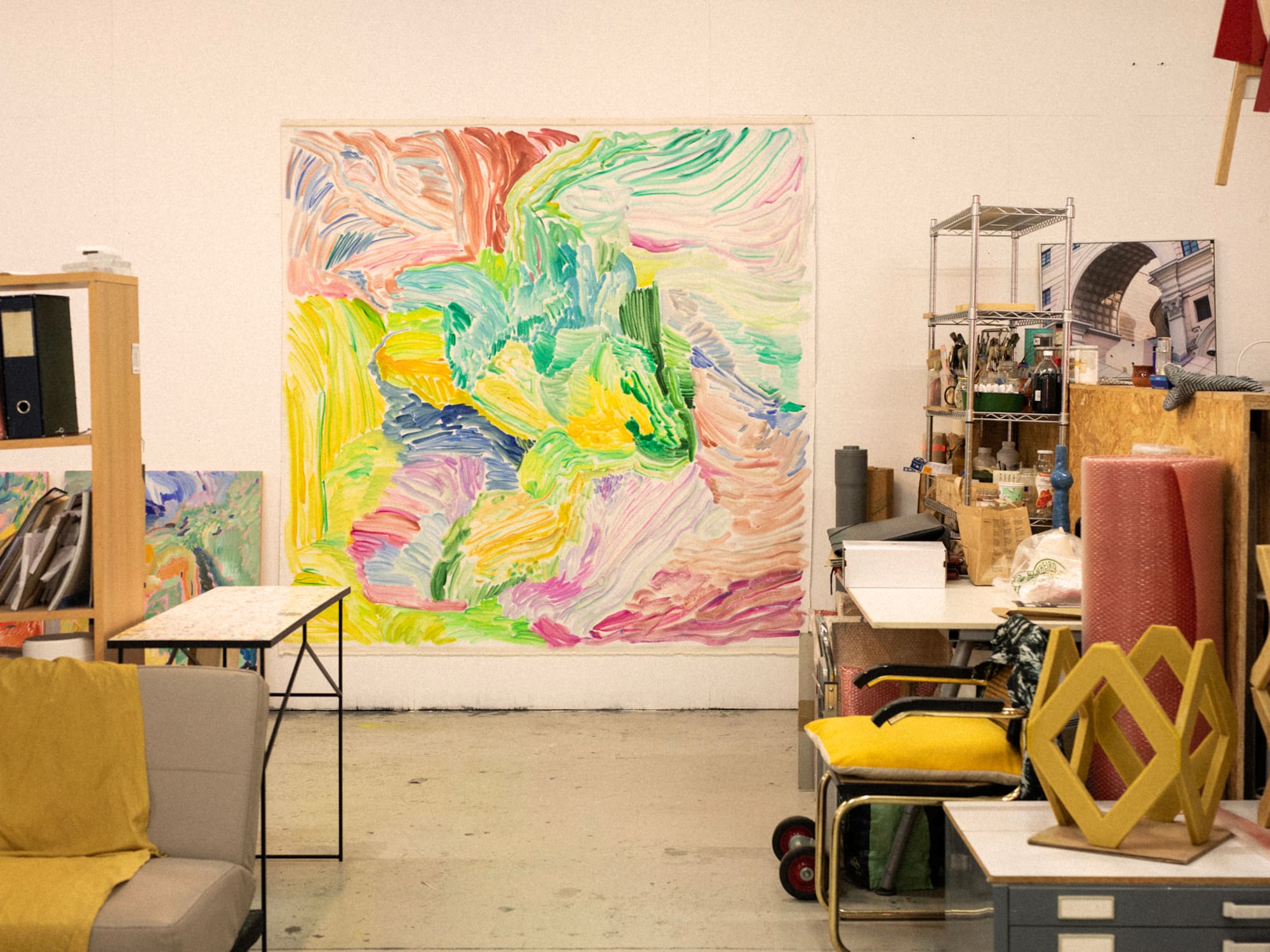 a room with a large painting on the wall