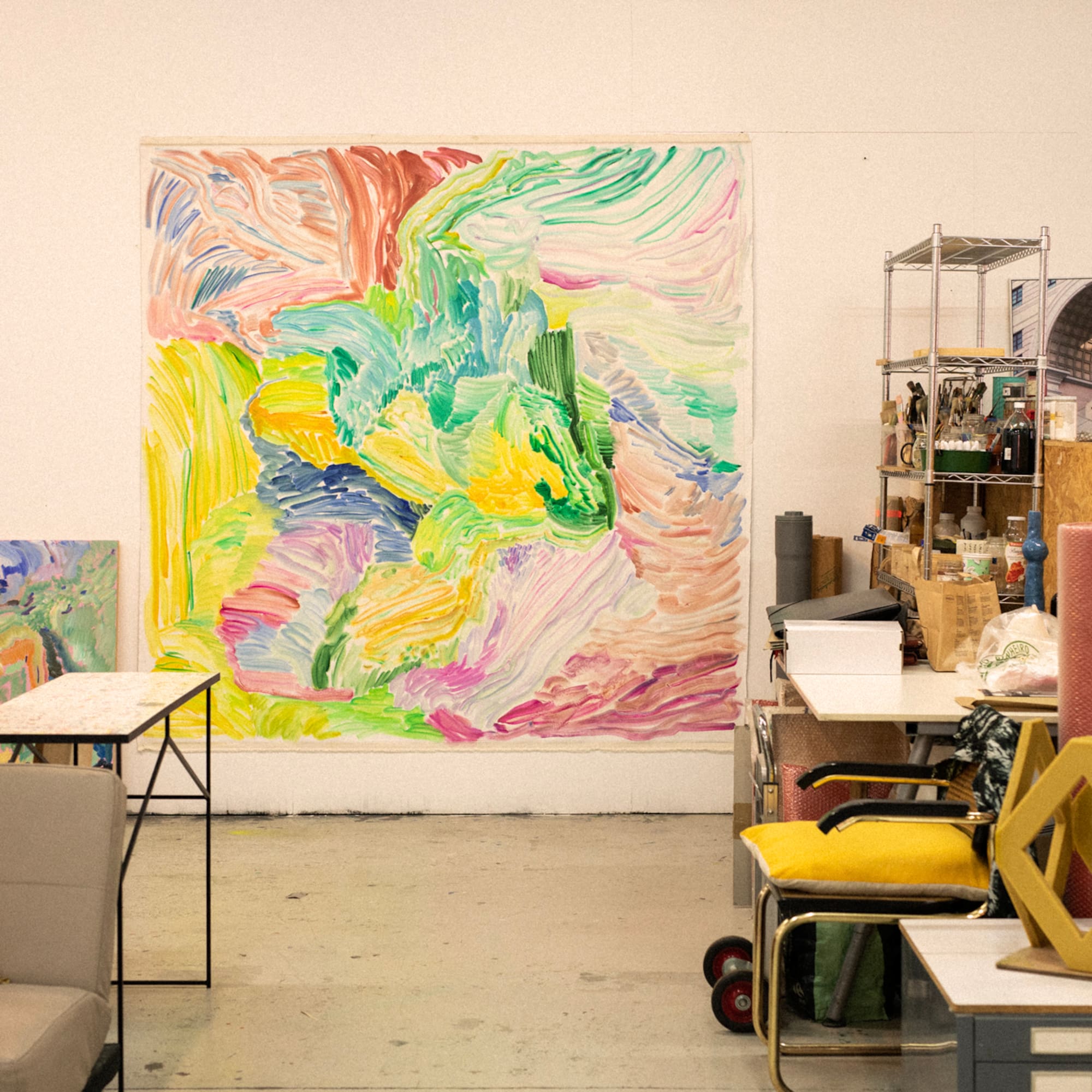 a room with a large painting on the wall