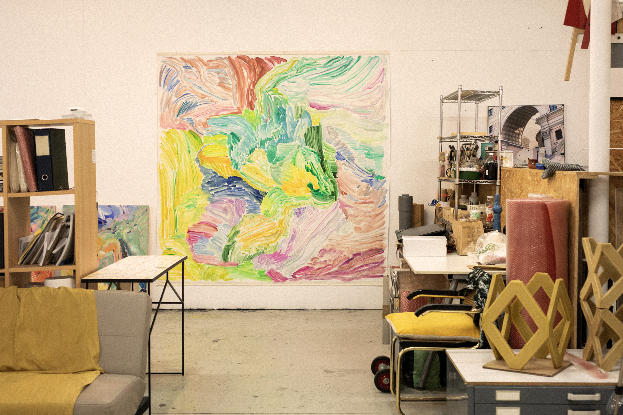 a room with a large painting on the wall