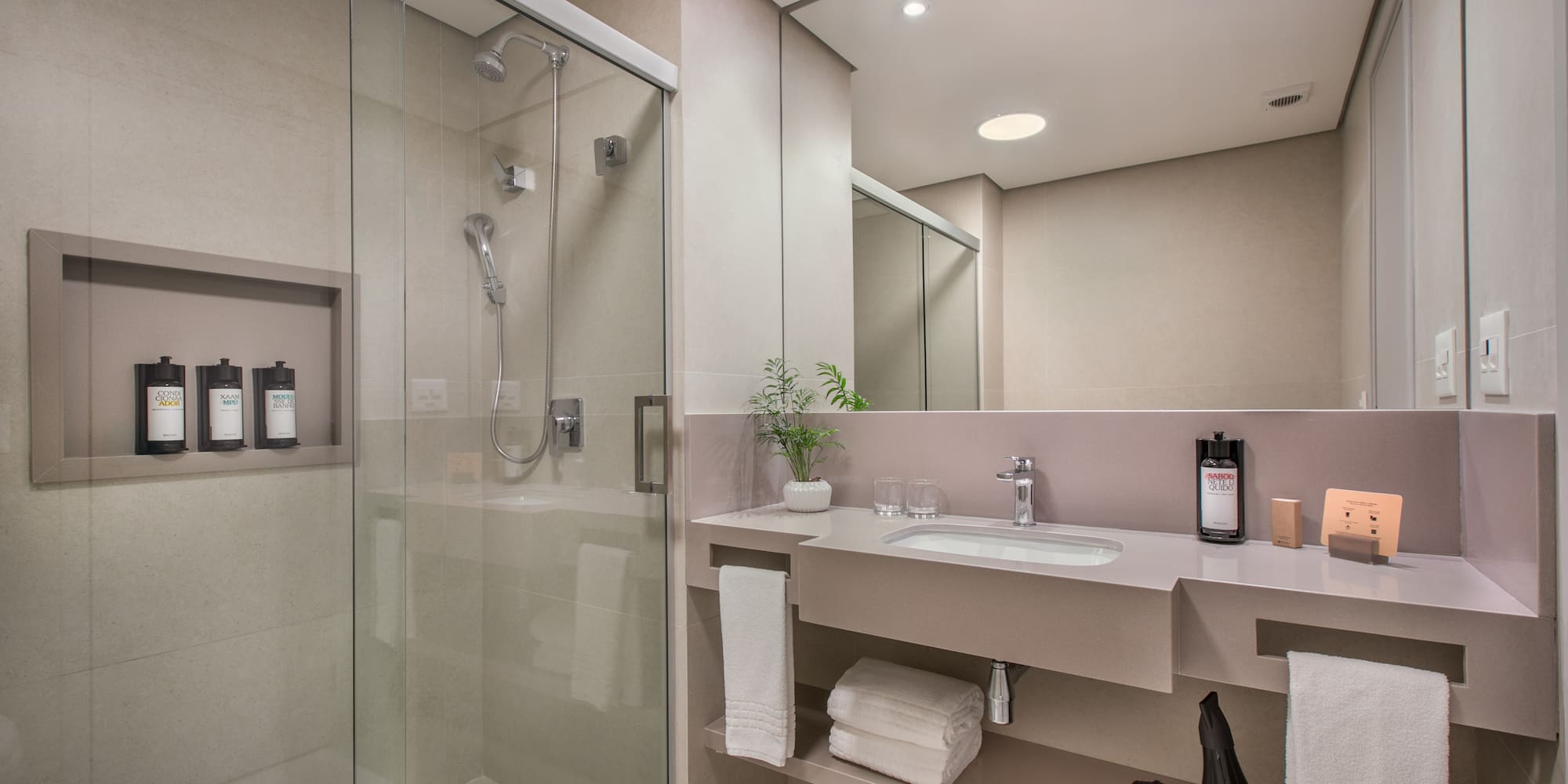 a bathroom with a shower and sink