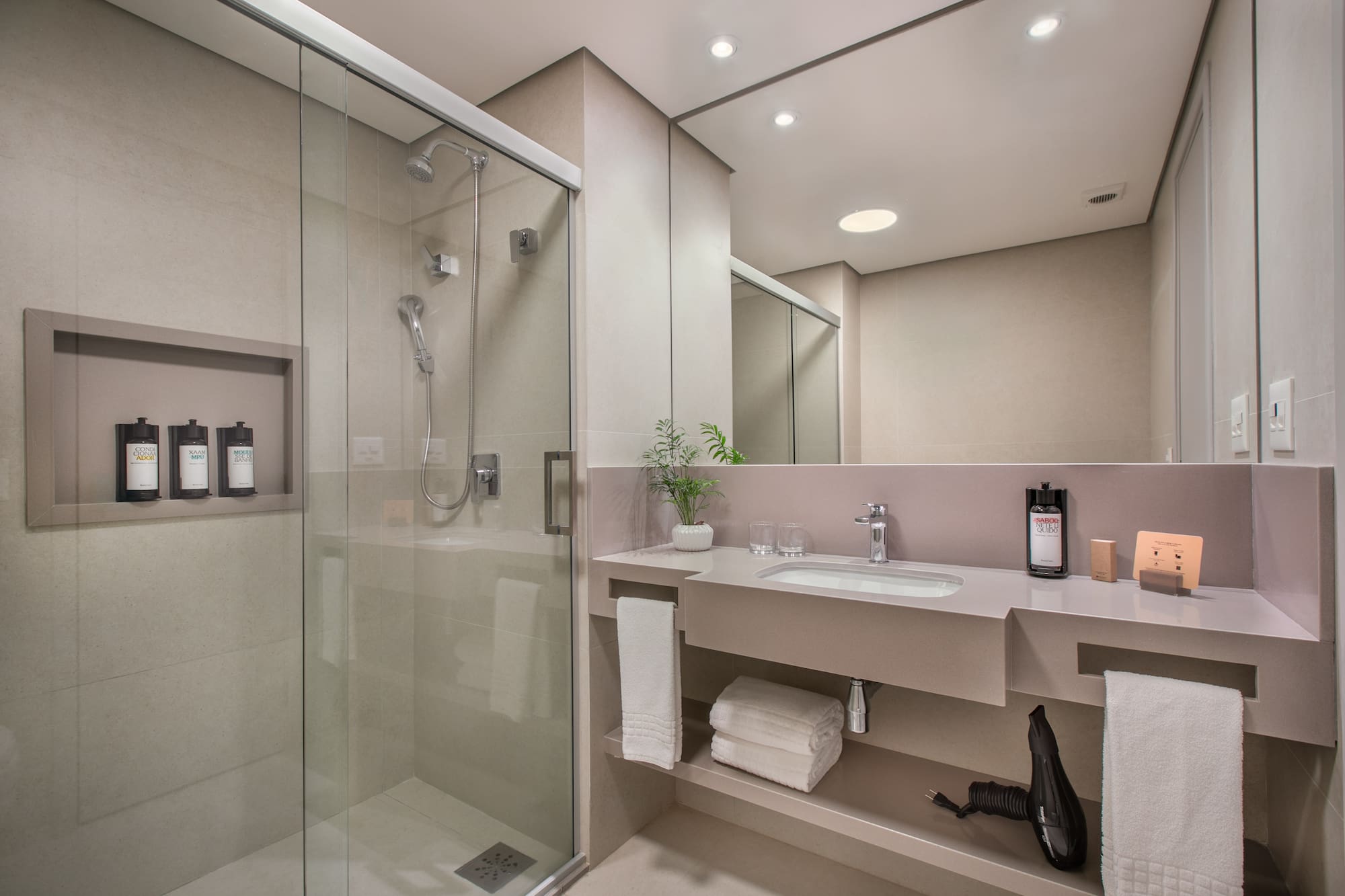 a bathroom with a shower and sink