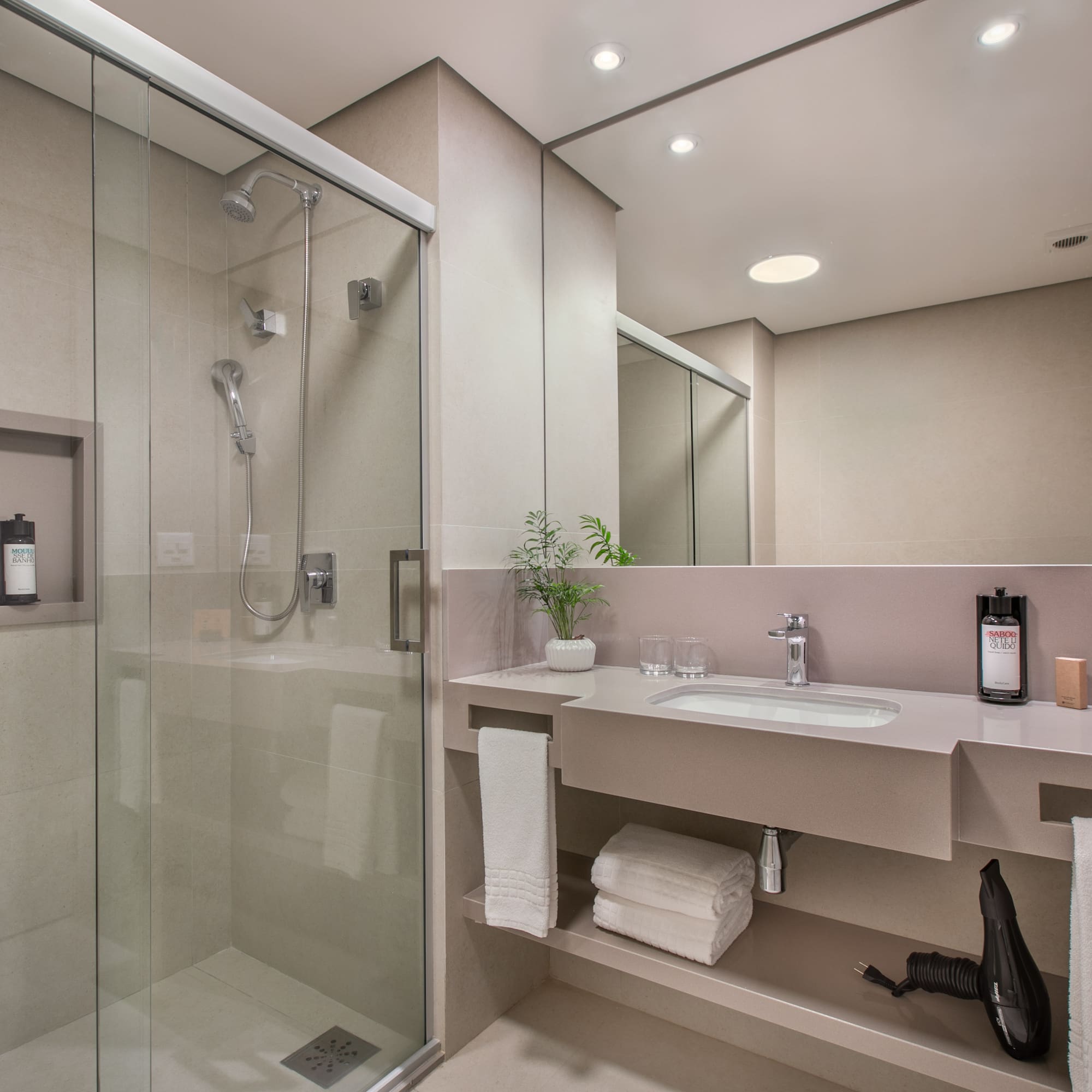 a bathroom with a shower and sink