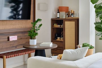 a living room with a tv and a table
