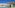 Luxury resort pool with swim-up bar, green tiles, and palm trees.