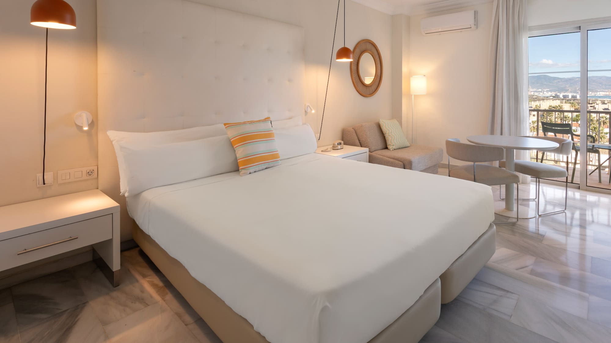 a bedroom with a bed and a table