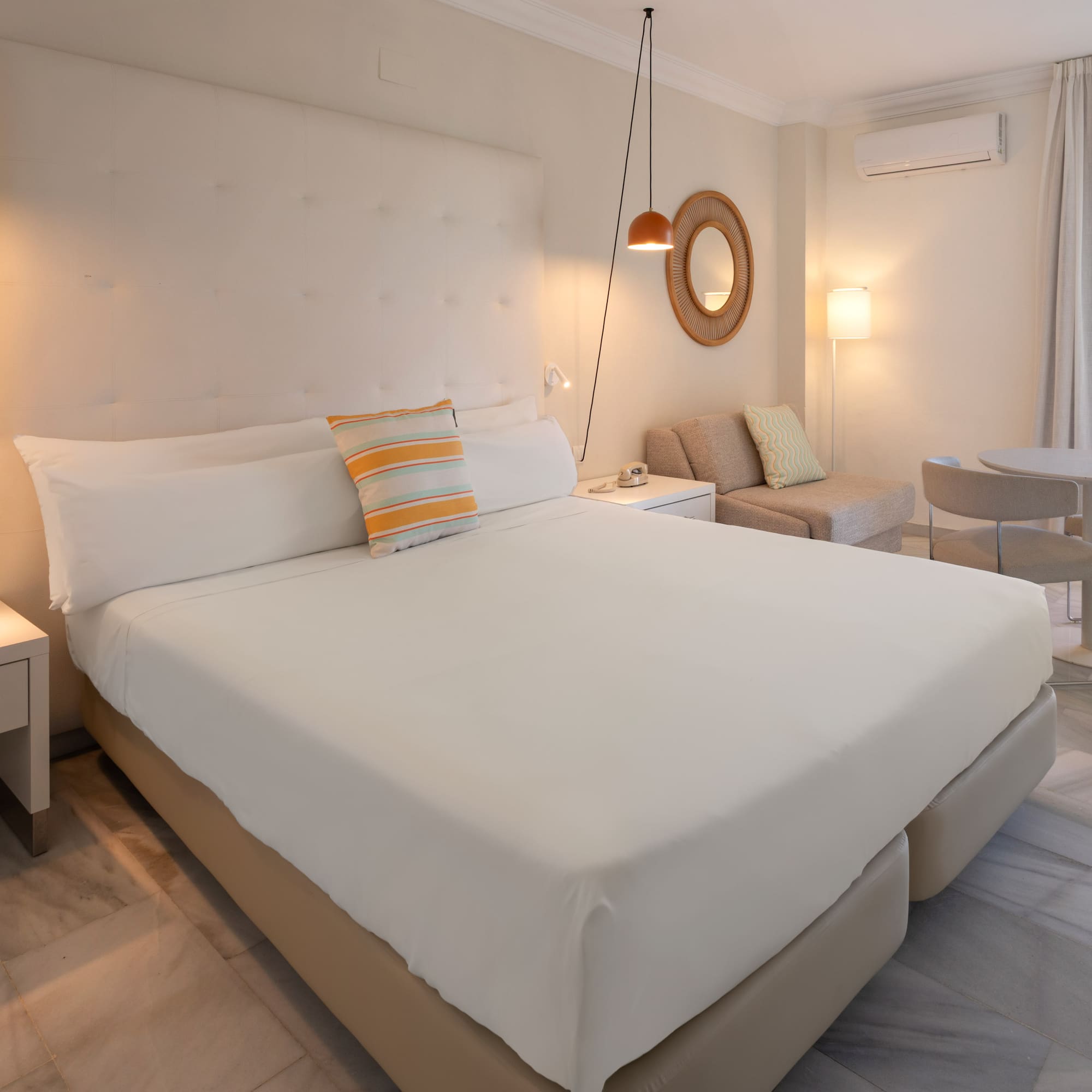 a bedroom with a bed and a table