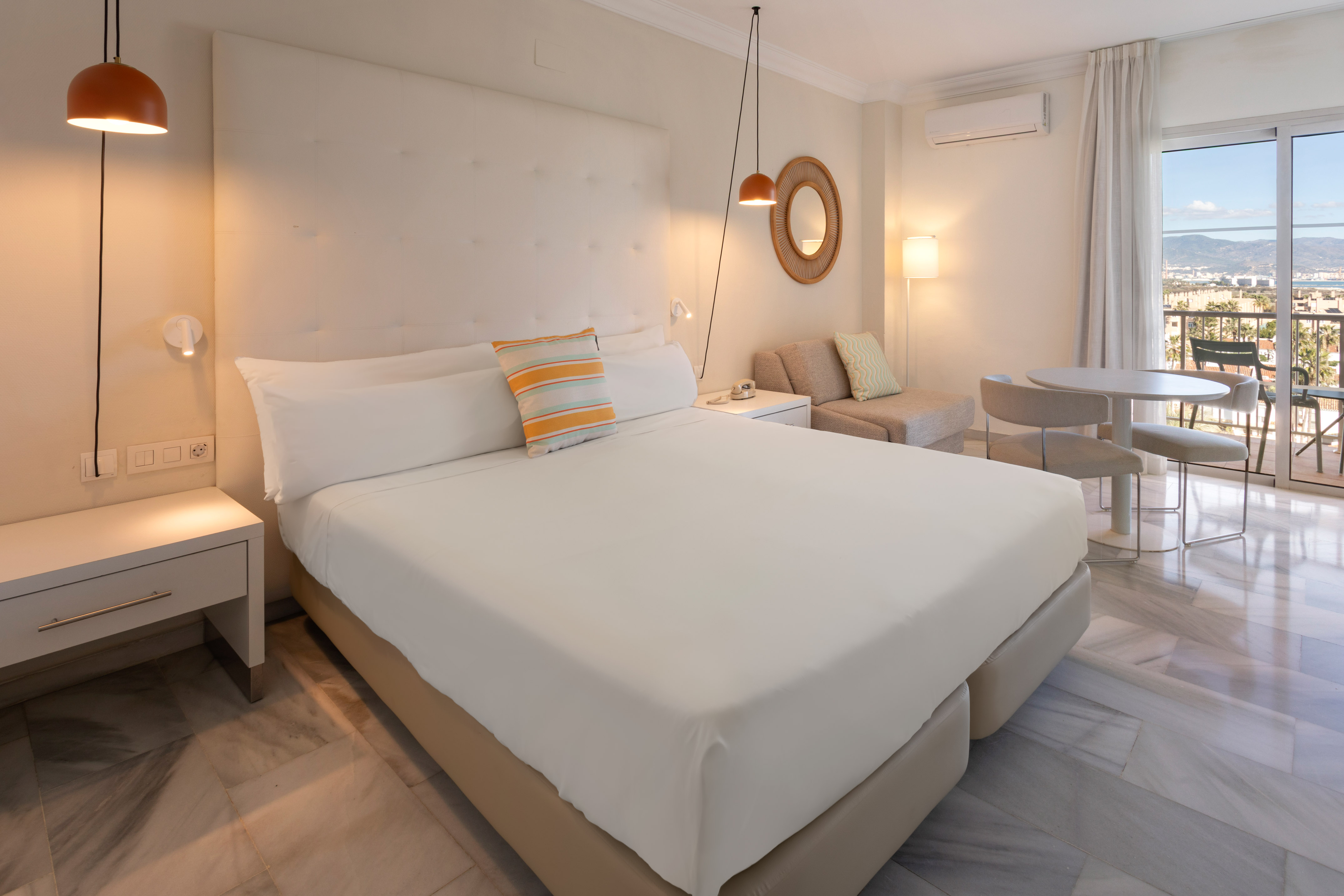 a bedroom with a bed and a table