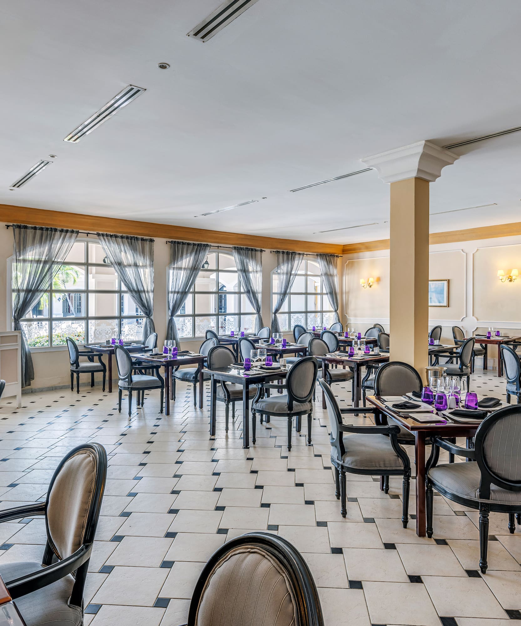 a room with tables and chairs