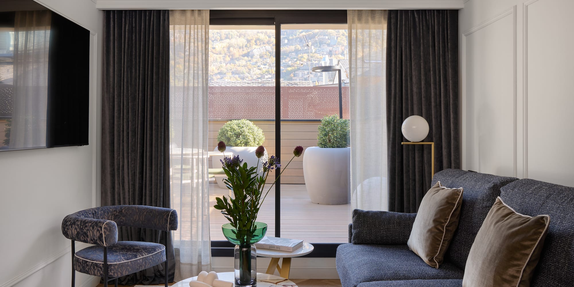 a living room with a couch and chairs