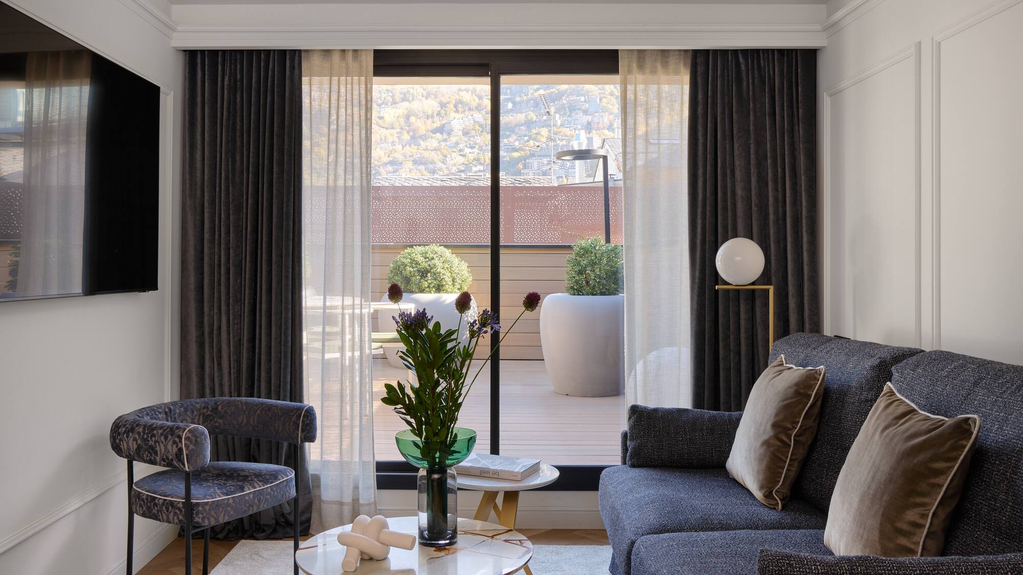 a living room with a couch and chairs