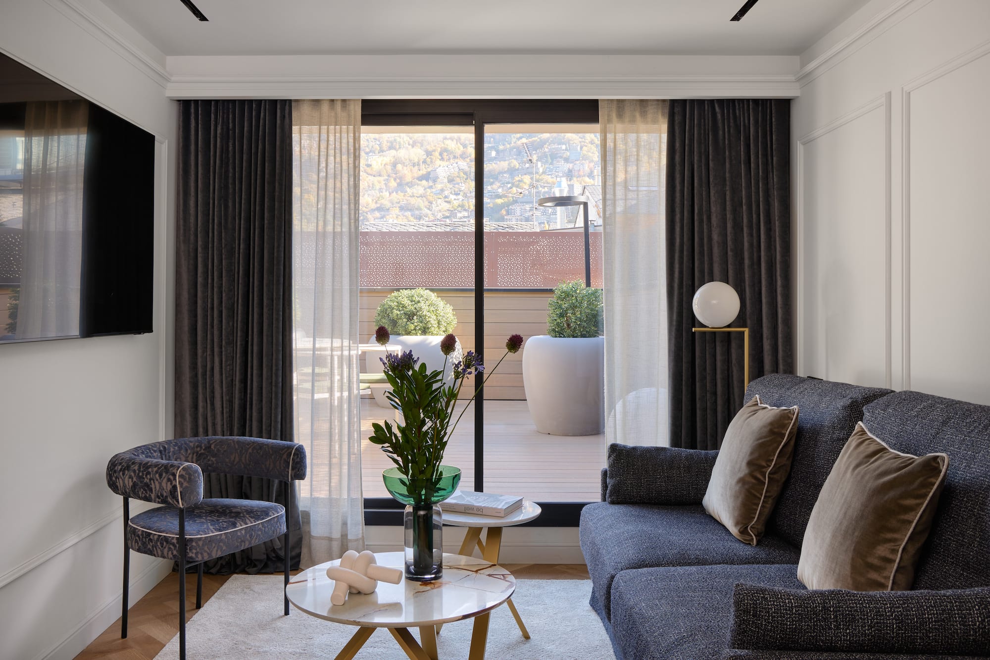 a living room with a couch and chairs