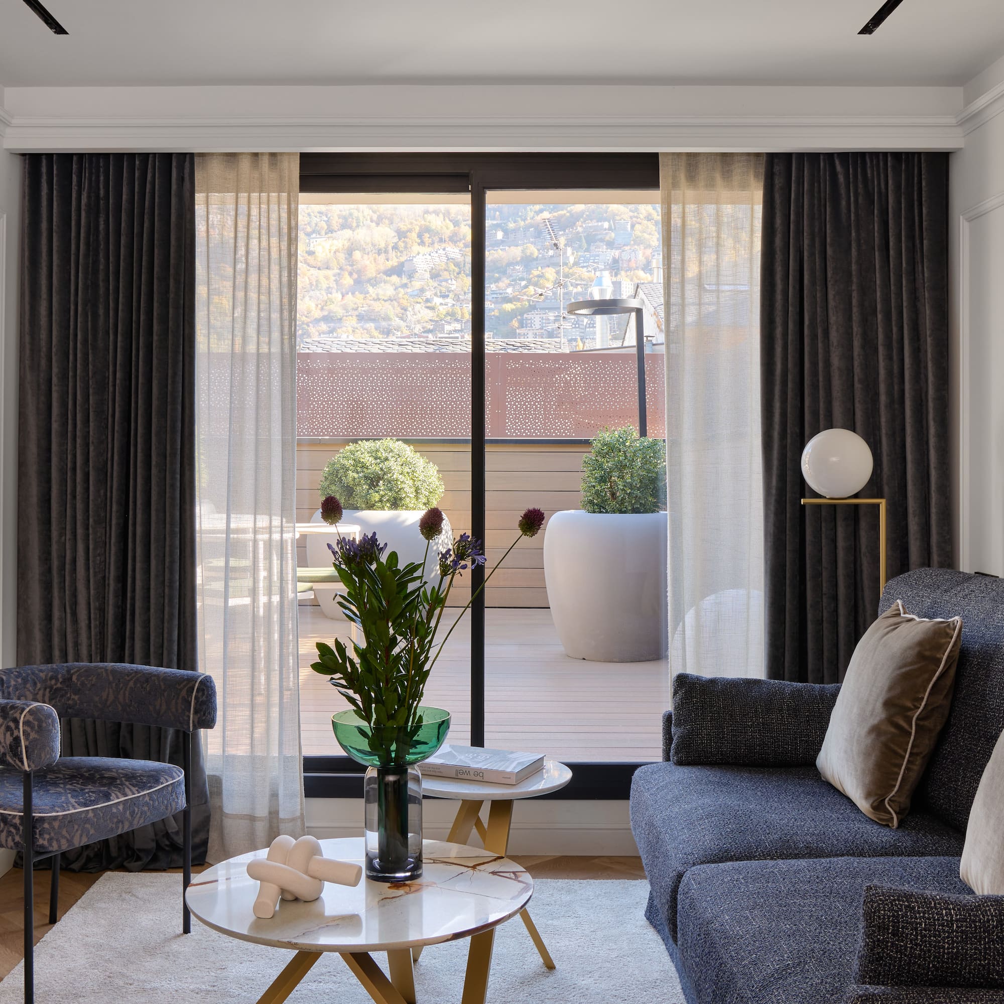 a living room with a couch and chairs