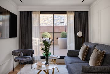 a living room with a couch and chairs