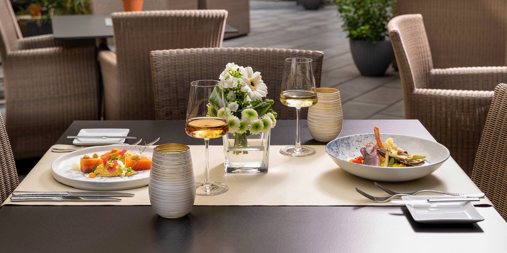 a table with food and wine glasses on it