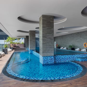 a pool with a stone wall and a stone wall