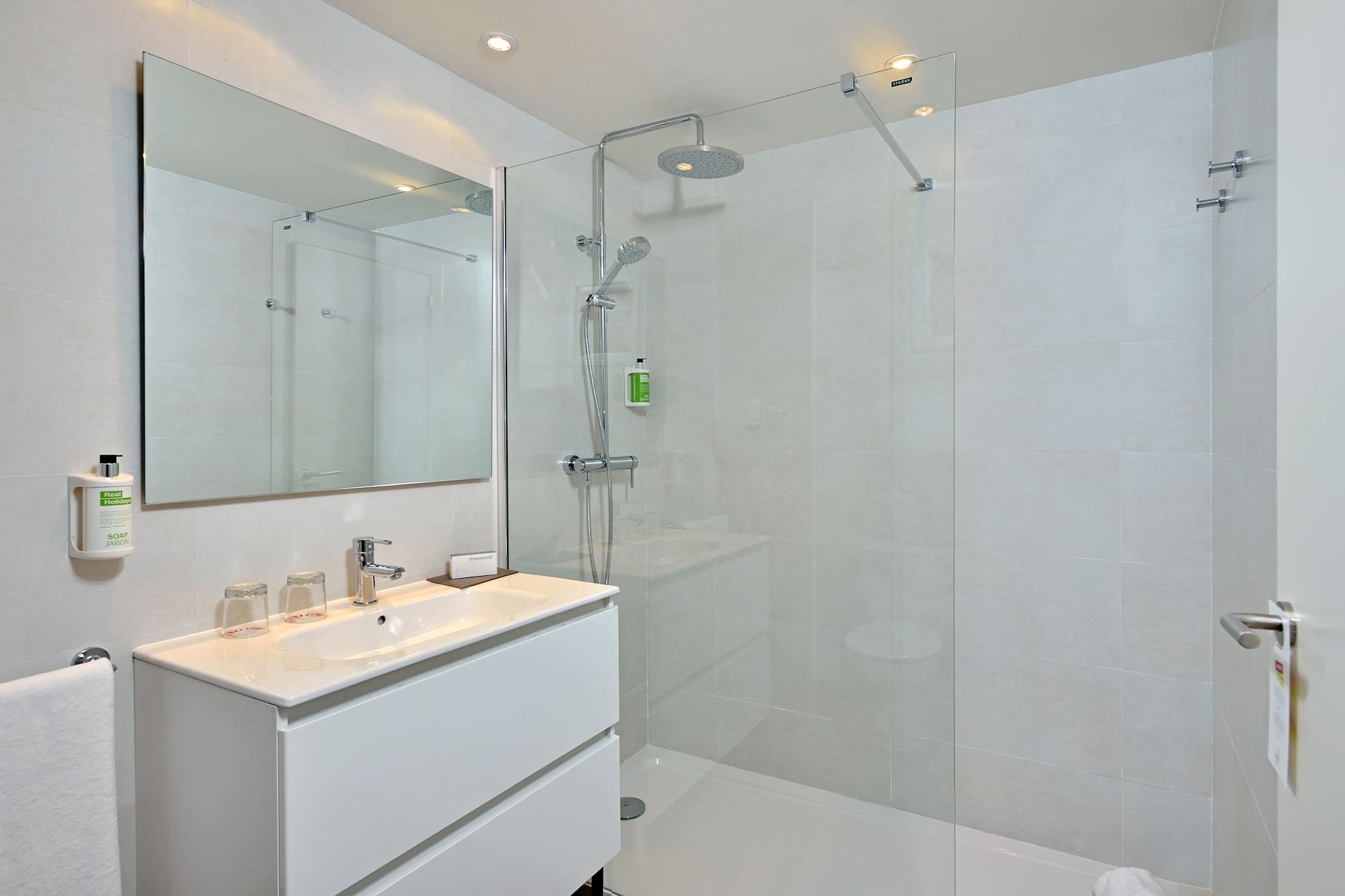 a bathroom with a shower and sink