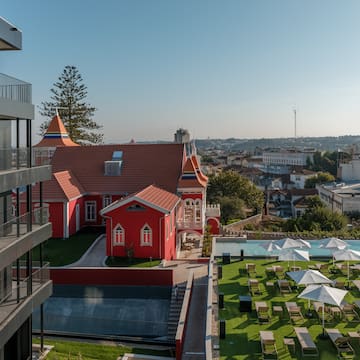 a building with a lawn and chairs