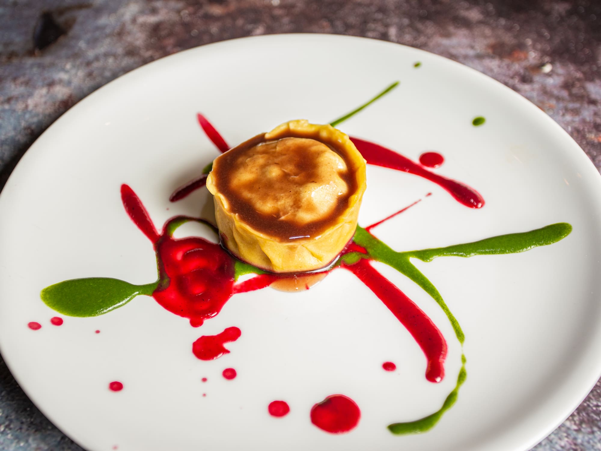 a plate of food with sauce on it